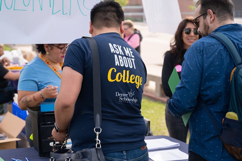 DSF College Advisor Miguel wearing his "Ask Me About College" shirt