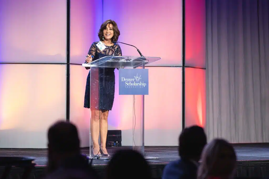 Anne Trujillo emceeing the DSF Homecoming Gala 2023