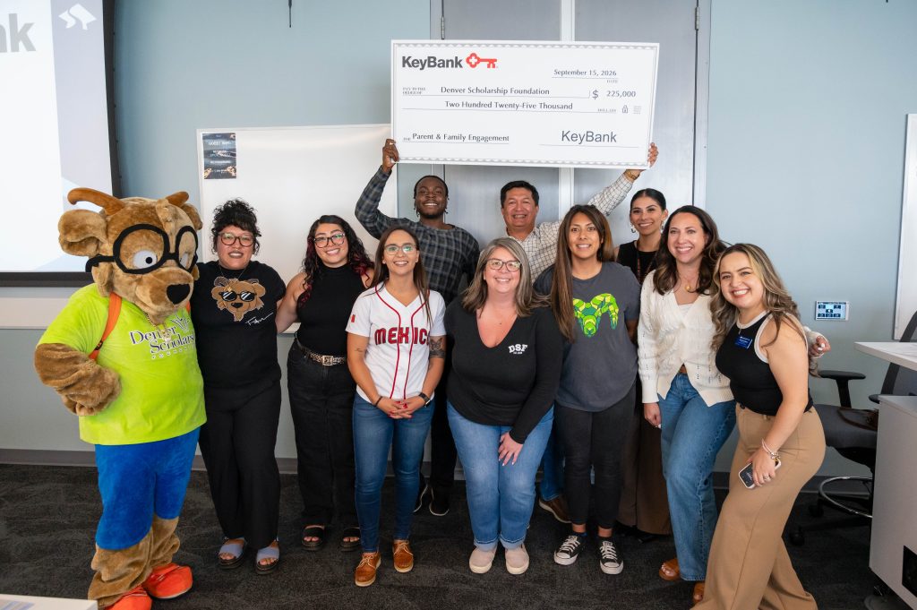 DSF Parent and Family Engagement Committee members pose with DSF mascot Future at the KeyBank check presentation. 