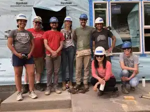 Group14 Engineering staff pose at a job site