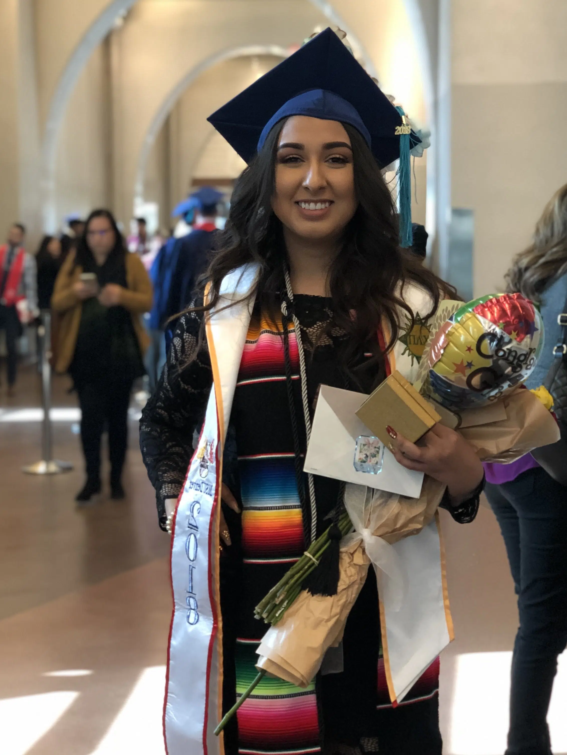 Perla Bustillos smiling at her college graduation