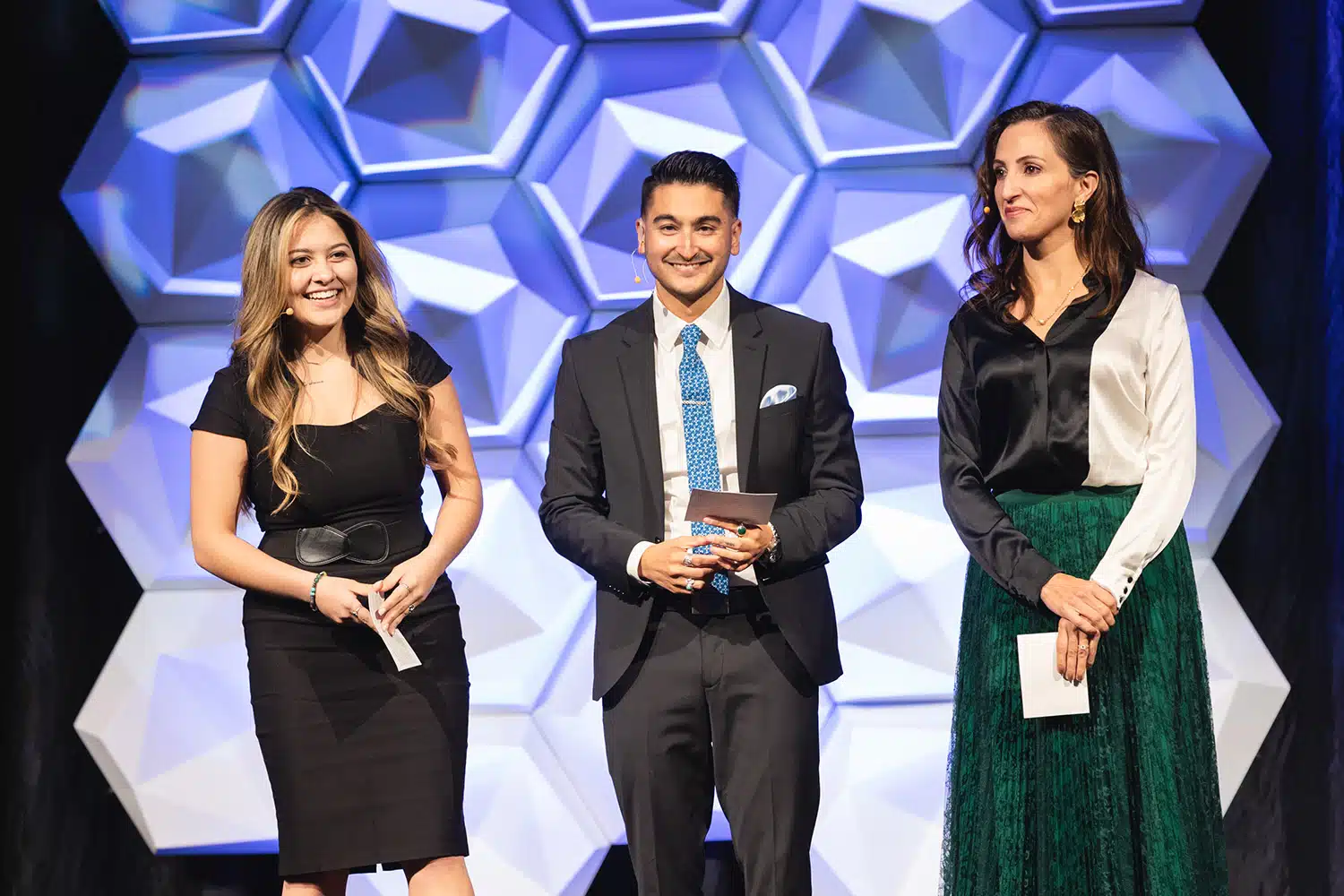 Sydnee Scadden, Derrek Sandoval, and Renae Bellew on stage at the 2022 DSF Gala