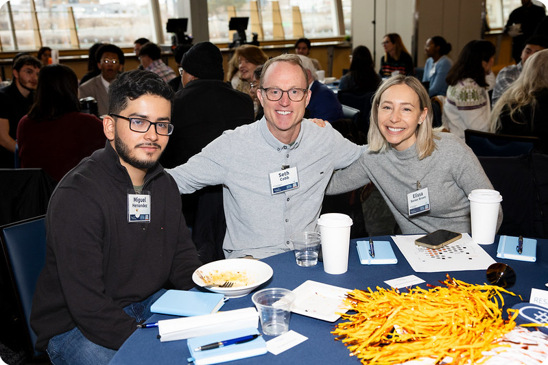 gathering-of-gratitude-side DSF Scholar poses at a table with Named Scholarship Donors from BOA at DSF Gathering of Gratitude